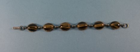 A Vintage Silver Bracelet Set with Cubuchon Cut Tigers Tooth Stones. 7.14 Inches In Length.