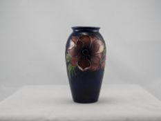 Moorcroft Tubelined Vase ' Anemone ' Design on Blue Ground. Height 7.25 Inches.