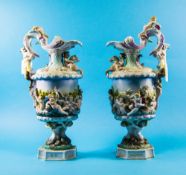 Pair Of large Continental Porcelain Urns Each vase decorated with cherubs And Satyr Moulded Handles,