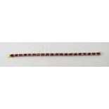 Silver Gilt Tennis Bracelet Set With 19 Ruby Red Coloured Stones Between Clear Faceted Spacers,