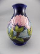 Moorcroft Tubelined Globular Shaped Vase, 'Magnolia' Design on Royal Blue Ground. Signed W.