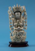 Indian Carved Ivory Deity Elaborately carved standing deity in a decorative headdress with multiple