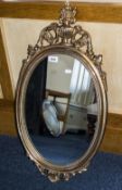 Modern Queen Anne Style Oval Wall Mirror with shell and acanthus decoration.