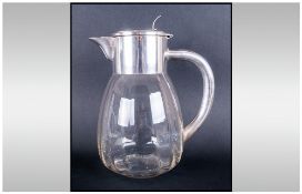 A German Early 20th Century Silver Plated And Glass Lidded Ice Jug Of Bulbous Form in the style of