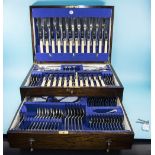 A Fine Quality Two Tier Oak Cased 90 Piece Canteen of Cutlery with key.