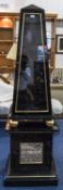 Black Lacquered Display Unit Of Unusual Obelisk Form Sectional Glazed Display Raised On Gilt Balls