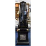 Black Lacquered Display Unit Of Unusual Obelisk Form Sectional Glazed Display Raised On Gilt Balls