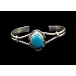 A Vintage Silver Bangle, Set To The Centre with a Large Cabochon Cut Blue / Green Stone.