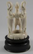 An Early 20th Century Figural Ivory and Ebony Stand In The Form of 3 Elephants In a Standing