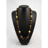 A Vintage Amber Bead Necklace with Gold Coloured Clasp. 30 Inches In Length. 70.7 grams.