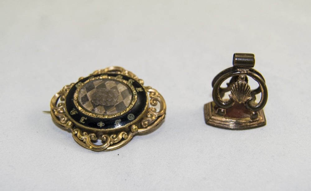 A 19th Century Gilt Metal and Enamel Mourning Brooch.