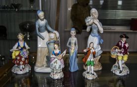 4 German Style Figurines Together With 3 Others