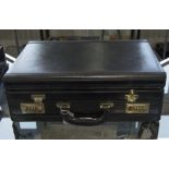 A Modern Black Leather Attache Case with Fitted Stationary Interior and Combination Locks.