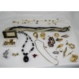 Bag of Monochrome Necklaces, gilt brooches,