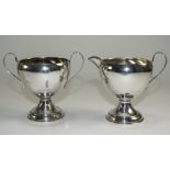 A Pair of Silver Two Handled Sugar Bowl and Milk Jug of Plain Form, Loaded Bases. Marked Sterling.