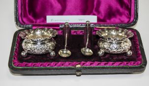 Victorian Pair of Silver Salts Complete with Spoon. Embossed Decoration to Bodies.