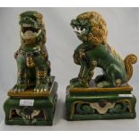 2 Modern Chinese Style Temple Dogs In Green And Beige Ground Raised On Shaped Rectangular Bases,
