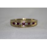 14ct Gold Ruby and Diamond Channel Set Ring. Marked 14 kt.