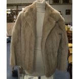 Ladies Short Blond Mink Jacket. Fully lined with hook and eye fastening and slit pockets. Some