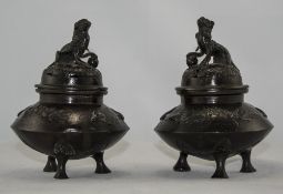 Pair Of Small Oriental Bronze Vases And Covers With Fu Dog Finials. Each Raised On Three Legs, The