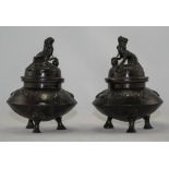 Pair Of Small Oriental Bronze Vases And Covers With Fu Dog Finials. Each Raised On Three Legs, The