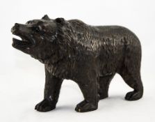 A Carved Black Forest Bear with Glass Eyes. Approx 10.5 Inches Length, 6.5 Inches HIgh.