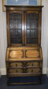 Early 20thC Oak Bureau Bookcase, Astral Glazed Bookshelf Above A Fall Front With Fitted Interior And