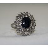 Ladies 1950's Platinum Set Diamond and Sapphire Cluster Ring, with Large Flower head Setting.