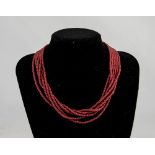 An Antique Six Strand Coral Bead Necklace.