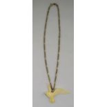 A Vintage 9ct Gold Chain with Attached Ivory Swallow Figure In Full Flight. Fully Hallmarked.