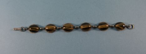 A Vintage Silver Bracelet Set with Cabochon Cut Tigers Tooth Stones. 7.14 Inches In Length.