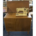 Singer Table Sewing Machine Finished In Teak With Three Drawers, Together With Accessories.
