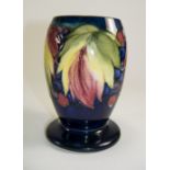 William Moorcroft Signed Vase ' Leaves and Berries ' Design on Blue Ground. c.1920's. 6 Inches High.