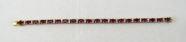 Silver Gilt Tennis Bracelet Set With 19 Ruby Red Coloured Stones Between Clear Faceted Spacers,