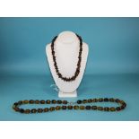 A Vintage Pair of Bead Necklaces. Lengths 35 and 22 Inches.
