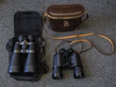 Two Pairs Of Binoculars. Both in cases.