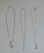 Three Small Silver and White Metal Pendants on chains