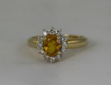 18ct Gold Set Diamond and Orange Sapphire Cluster Ring - Flower head Design. The Central Orange