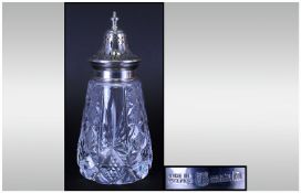 A Silver Topped Cut Glass Sugar Sifter of good quality. Hallmark Birmingham 1964. 6.25" in height.