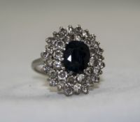 Ladies 1950's Platinum Set Diamond and Sapphire Cluster Ring, with Large Flower head Setting. The