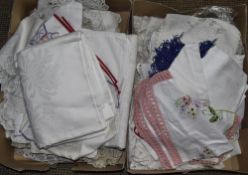 Two Boxes Of Assorted Linen. Including Crocheted Table Mats, Table Cloths, Doilies, etc.