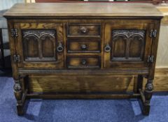 Priory Style Oak Sideboard, Comprising 2 Cupboards Either Side Of Three Central Drawers.