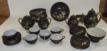 Mid 20thC Japanese Egg Shell Tea Service Black Matt Ground with Figural Landscapes And Gilt