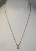 A Ladies 9ct Gold Set Diamond Drop Attached To A 9ct Gold Chain. Fully Hallmarked. Nice Condition