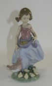 Lladro Figurine "Afternoon Snack" Girl Feeding Chickens. Model Number 6577. Issued 2000.