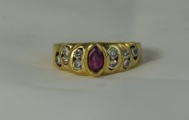 18ct Gold Set Ruby and Diamond Ring, The Central Ruby Flanked by 10 Diamonds, Five to Either Side.