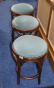 Three Matching Wooden Stools with green upholstered fabric seats.