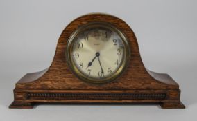 Oak Cased Mantle Clock. Silvered Dial. Height 6 inches, Width 10.75 inches.