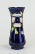 William Moorcroft Signed Vase ' Pansy ' Pattern on Blue Ground c.1920's. Signed to Base. Height 7.