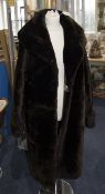 Full Length Dark Brown Beaver Lamb Coat fully lined slit pockets and rever colalr.